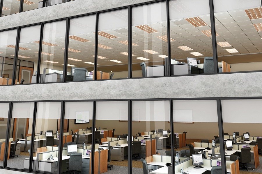 Windowed office building utilizing smart shades for sunlight control.