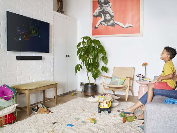 kid playing in room with sonos sound bar