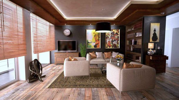 living room with shades and wooden floors