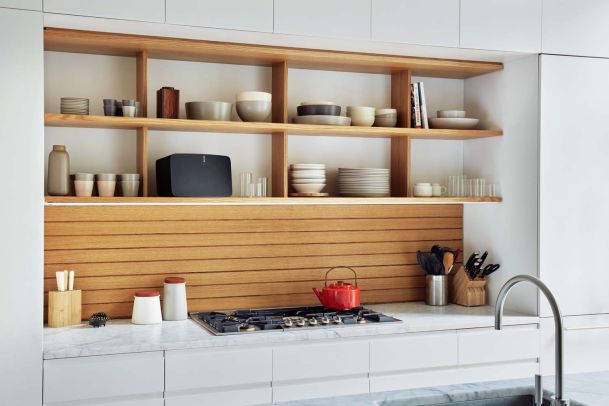 sonos speaker on wooden shelf in kitchen